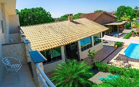 CASA PREMIUM em Peruíbe com FOGUEIRA, Brinquedoteca, Piscina, Lareira de Jardim, Churrasqueira e 4 grandes quartos para 16 pessoas!